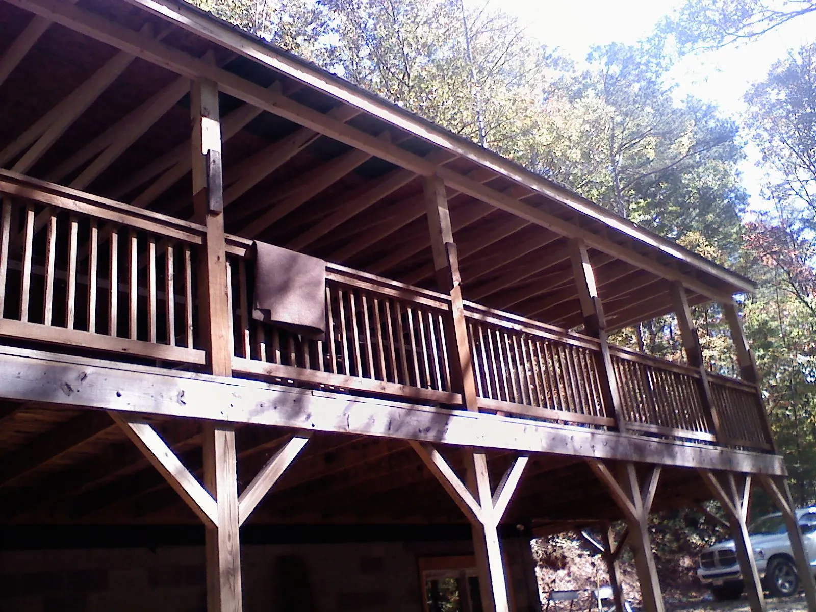 Timber framing under a new elevated porch and deck — Roof Leak Repair in Peoria Heights by Roofing Brothers